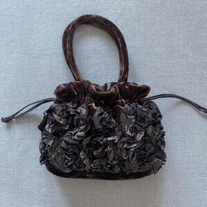 Brown velvet rosette purse.
